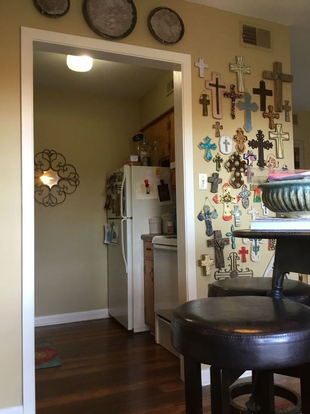 Kitchen doorway in Unit 207 with white appliances — furniture and decor not included